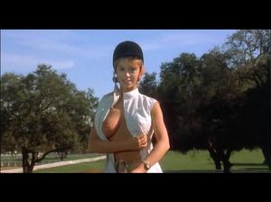 Развратная девка с голыми сиськами играет в поло